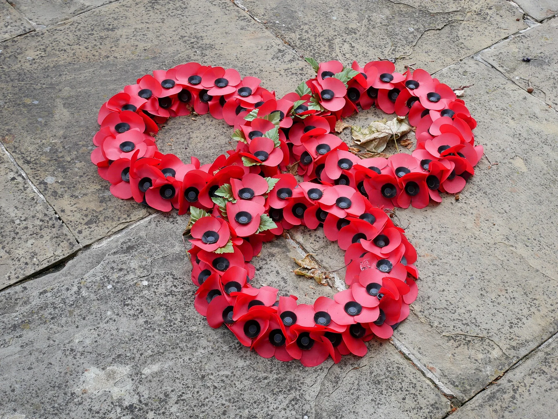 Red remembrance poppy wreaths at Guy’s Hospital War Memorial